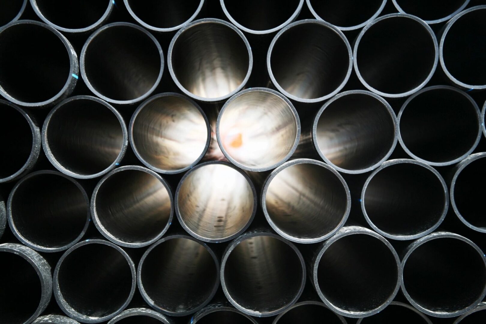 A bunch of pipes that are stacked together